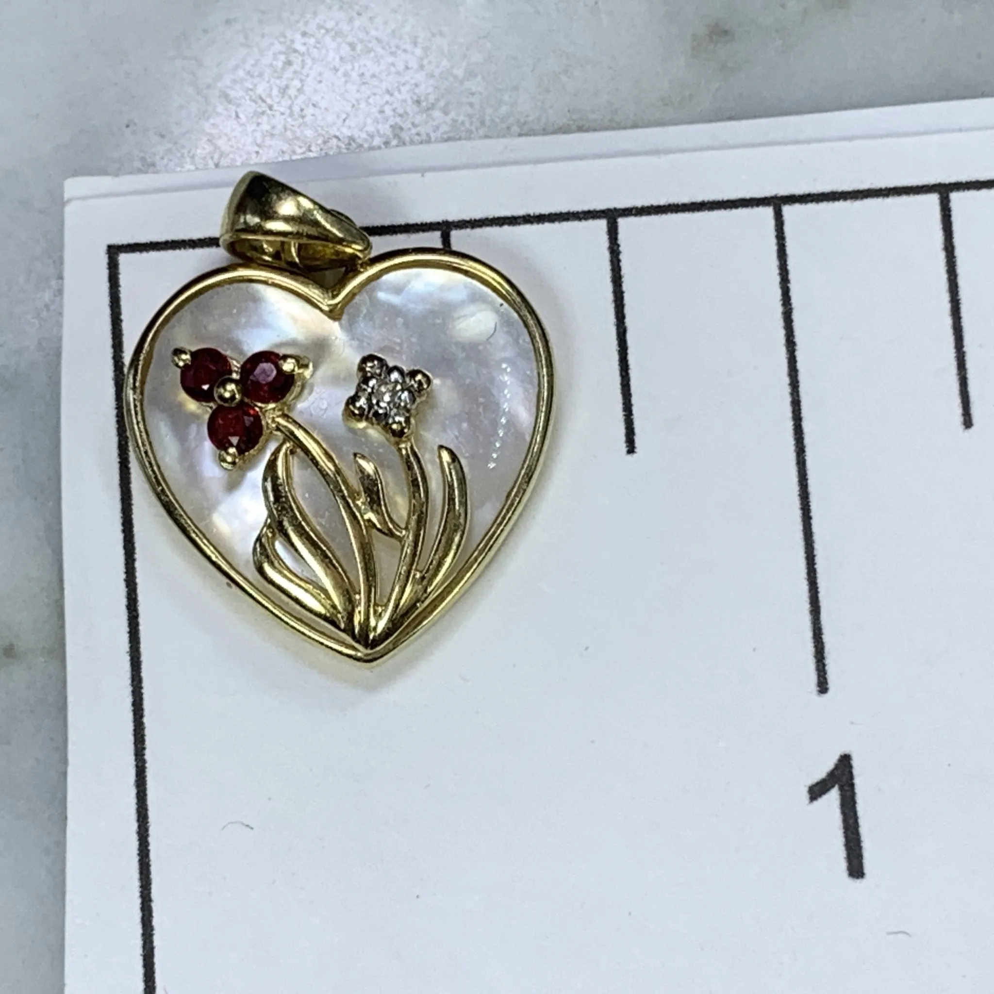 1960s Heart Shaped Mother of Pearl Pendant with Diamond and Ruby Flowers set in 10k Yellow Gold.