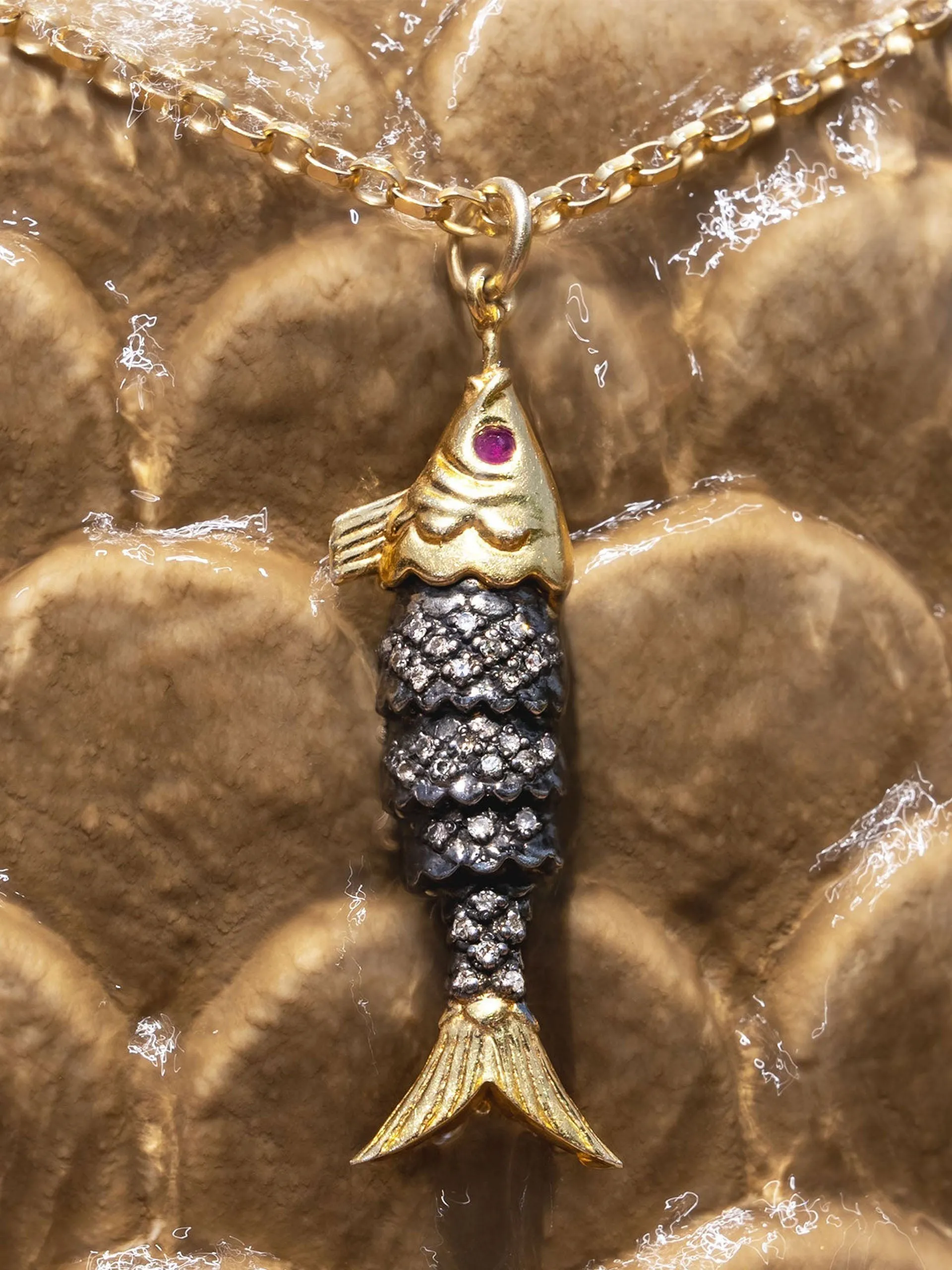 Diamond and ruby fish pendant