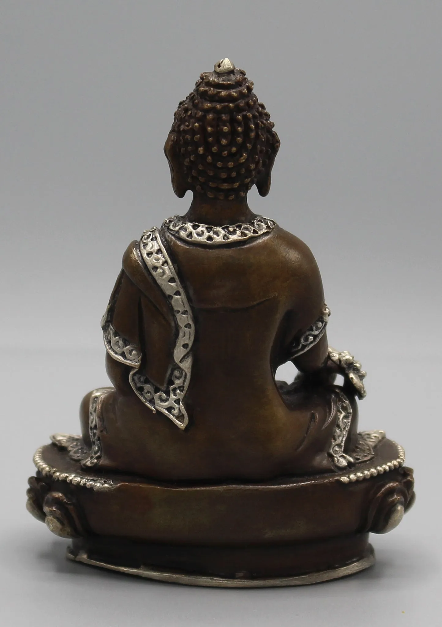 Finely carved Copper Medicine Buddha Statue inlaid Silver Robes